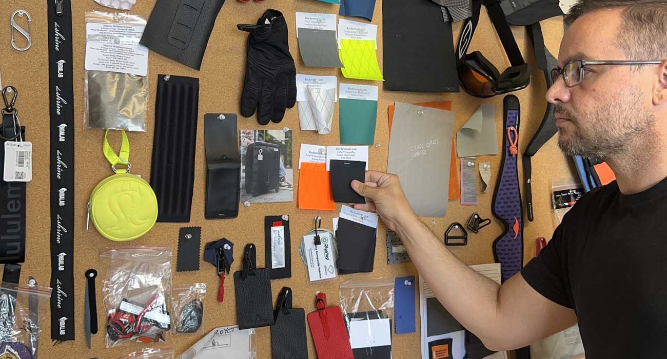 Soft goods product development consultant reviewing prototypes and manufacturing samples