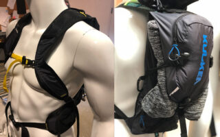 Designer evaluating the fit of a wearable soft goods prototype before manufacturing to improve comfort and ergonomics.