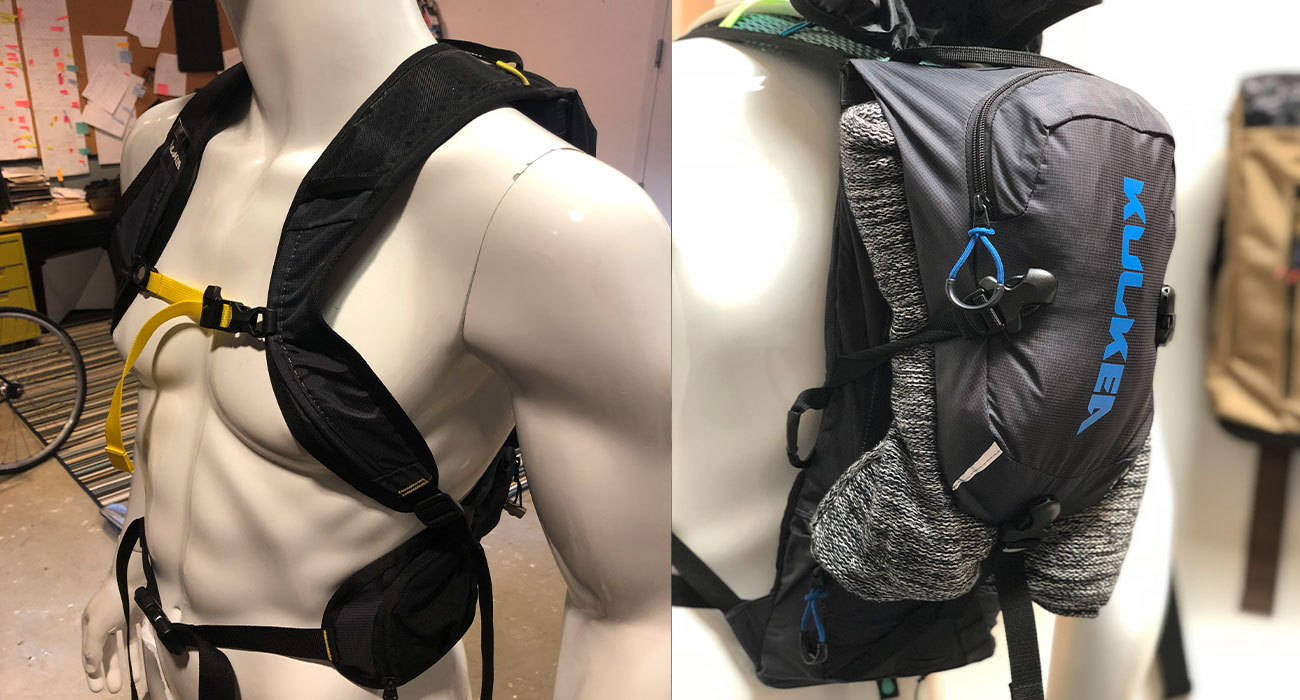 Designer evaluating the fit of a wearable soft goods prototype before manufacturing to improve comfort and ergonomics.