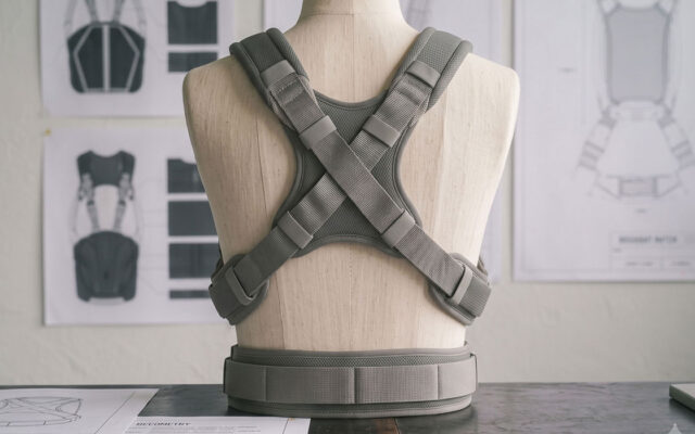 Engineer reviewing scalable soft goods product design featuring construction details, materials, and manufacturing considerations for a premium sewn product.